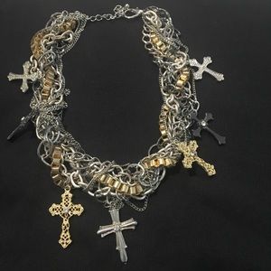 Costume jewelry with silver and gold crosses.